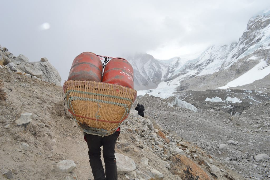 Porter carrying gas cylinder in high altitude